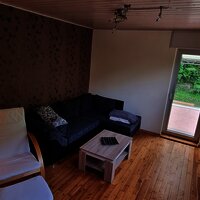 Wohnzimmer mit Zugang zur Terrasse